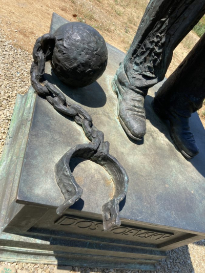 ball and chain at base of statue